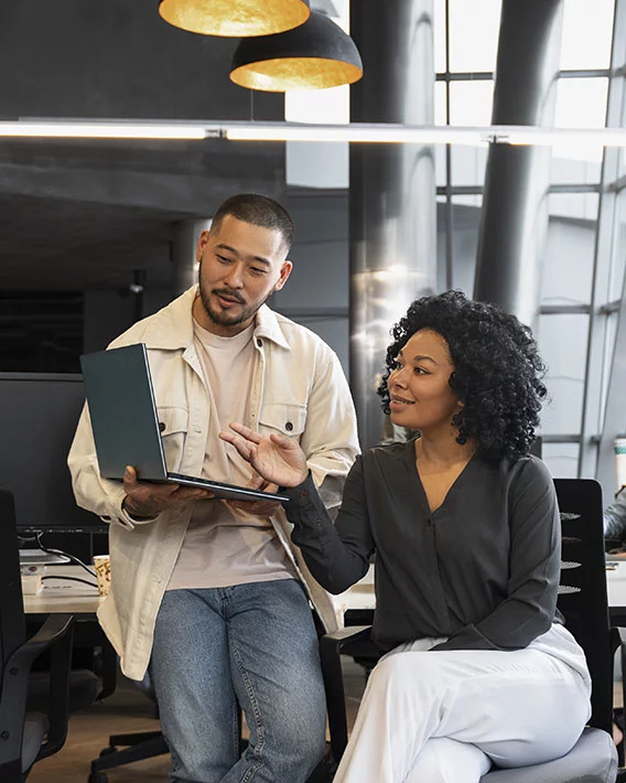 Smiling Sollar Tech team members discussing solar solutions